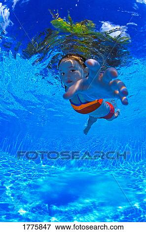 Girl swimming underwater View Large Photo Image Stock Photo - Girl swimming underwater. Fotosearch