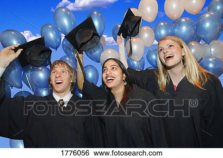 Graduates tossing caps View Large Photo Image Stock Photograph - Graduates tossing caps. Fotosearch