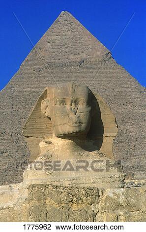 Stock Image - Great Sphinx statue and pyramid. Fotosearch