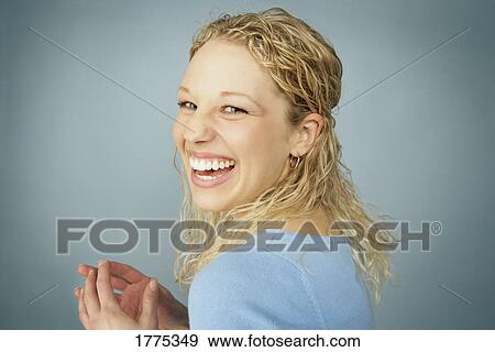 Stock Photo - Laughing pretty teenager. Fotosearch