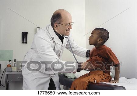 Stock Image - Little boy having a check-up. Fotosearch