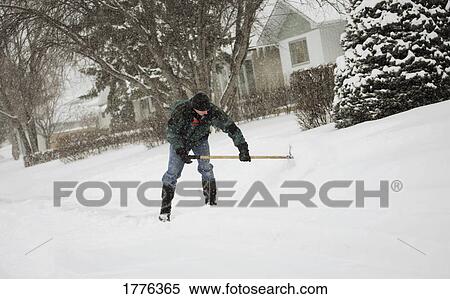 Man clearing snow View Large Photo Image Stock Photography - Man clearing snow. Fotosearch