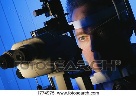 Man having eye test View Large Photo Image Stock Photography - Man having eye test. Fotosearch