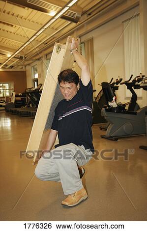 Stock Photograph - Man in rehab after injury. Fotosearch