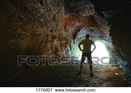 Stock Photo - Man inside tunnel. Fotosearch