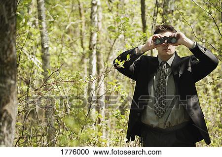Man with a pair of binoculars View Large Photo Image Stock Image - Man with a pair of binoculars. Fotosearch