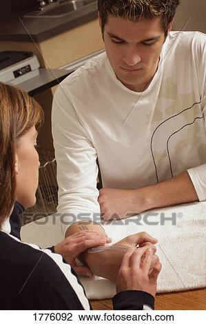 Man's arm being taped View Large Photo Image Stock Image - Man's arm being taped. Fotosearch