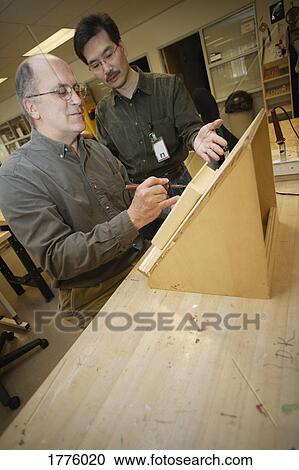 Stock Image - Mature student receives guidance. Fotosearch