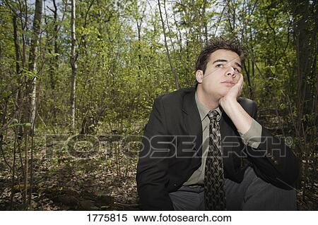 Stock Photography - Morose young business man. Fotosearch