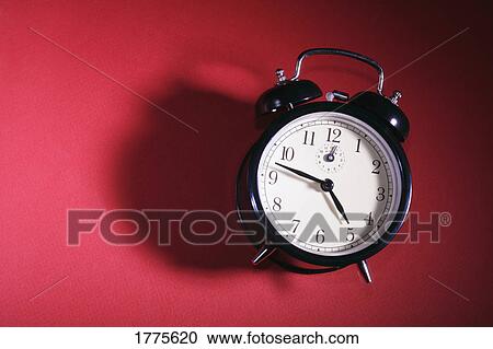 Stock Image - Old-fashioned alarm clock. Fotosearch
