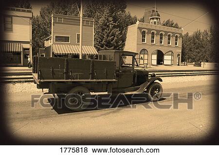 Stock Photo - Old fashioned sepia truck and road. Fotosearch