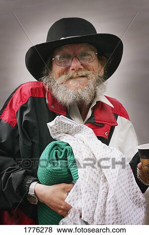 Old man with blanket and paper cup View Large Photo Image Stock Photo - Old man with blanket and paper cup. Fotosearch