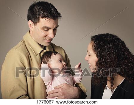 Parents with small child View Large Photo Image Stock Photo - Parents with small child. Fotosearch