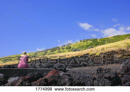 Stock Photo - Person looking up hillside. Fotosearch