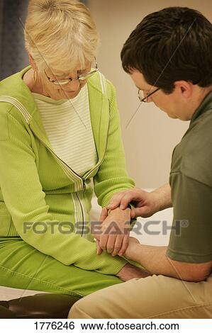 Stock Photograph - Physiotherapist at work. Fotosearch
