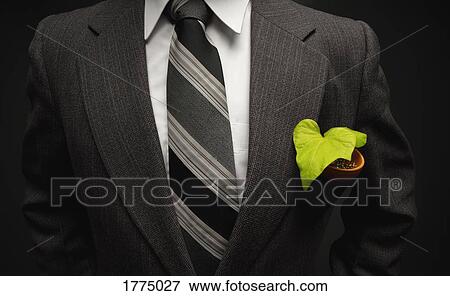 Stock Photo - Plant in pocket of businessman. Fotosearch