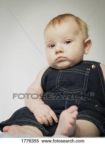 Portrait of a solemn baby boy View Large Photo Image Stock Photography - Portrait of a solemn baby boy. Fotosearch