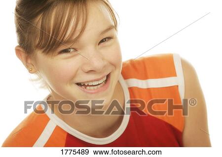 Portrait of smiling young girl View Large Photo Image Stock Photo - Portrait of smiling young girl. Fotosearch