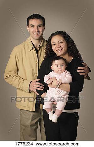Picture - Proud parents and baby. Fotosearch