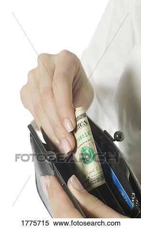 Putting money away View Large Photo Image Stock Photography - Putting money away. Fotosearch