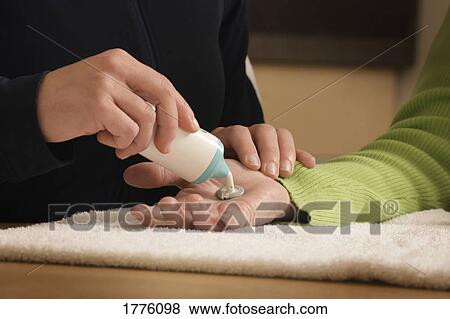 Salve put on hand View Large Photo Image Stock Photo - Salve put on hand. Fotosearch