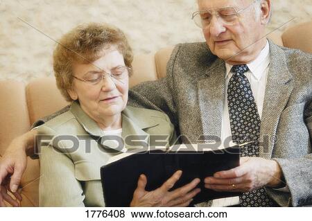 Stock Photo - Senior couple reading bible. Fotosearch