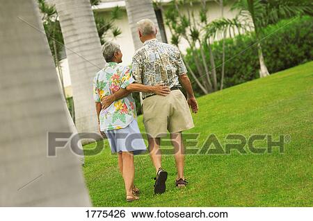 Stock Photograph - Senior couple walking. Fotosearch