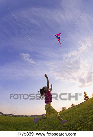 Small girl and kite View Large Photo Image Stock Photo - Small girl and kite. Fotosearch
