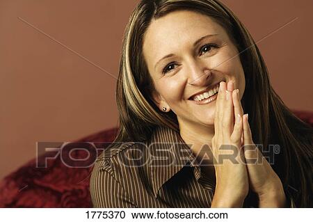 Smiling grateful woman View Large Photo Image Stock Image - Smiling grateful woman. Fotosearch