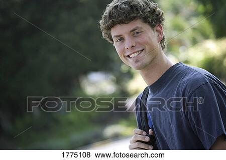 Smiling male student View Large Photo Image Stock Photo - Smiling male student. Fotosearch