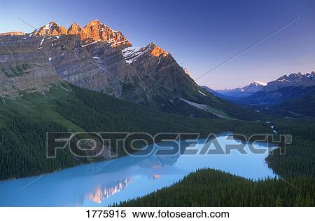 Stock Photography - Snowy peak mountain with valley. Fotosearch