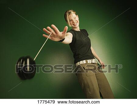 Teenage girl with yo-yo View Large Photo Image Stock Photo - Teenage girl with yo-yo. Fotosearch
