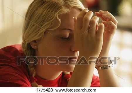 Teenager praying View Large Photo Image Stock Photo - Teenager praying. Fotosearch