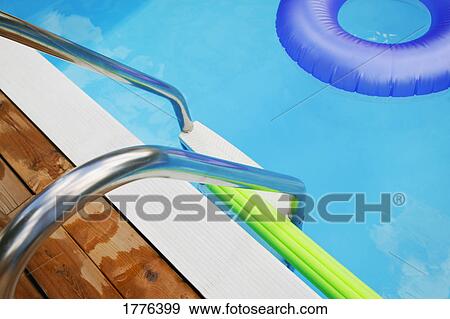 Toys in swimming pool View Large Photo Image Stock Photo - Toys in swimming pool. Fotosearch