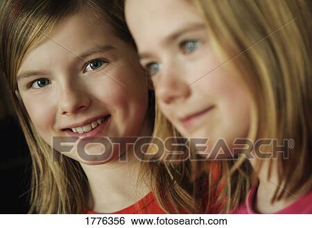 Two girls together View Large Photo Image Stock Photograph - Two girls together. Fotosearch