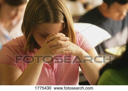 Stock Image - Woman praying. Fotosearch