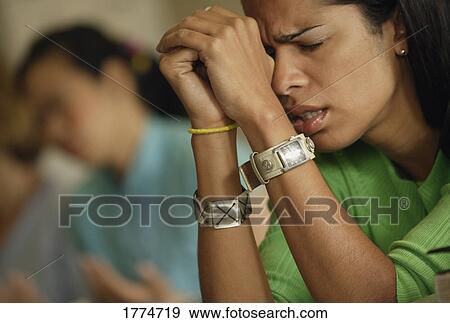 Woman praying with hands clasped View Large Photo Image Stock Photo - Woman praying with hands clasped. Fotosearch