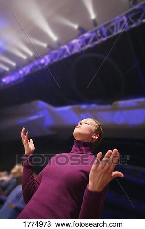 Woman worshiping View Large Photo Image Stock Photo - Woman worshiping. Fotosearch
