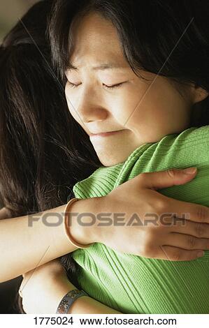 Women hugging View Large Photo Image Picture - Women hugging. Fotosearch