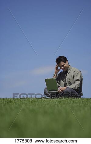 Stock Photo - Working outdoors. Fotosearch