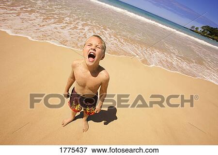 Young boy crying on beach View Large Photo Image Stock Photo - Young boy crying on beach. Fotosearch