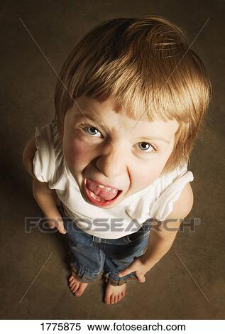 Stock Photography - Young girl making face. Fotosearch