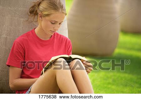 Young woman reading View Large Photo Image Stock Photo - Young woman reading. Fotosearch