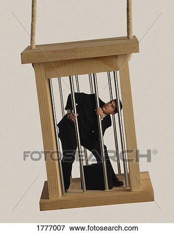 A caged business man View Large Photo Image Stock Photo - A caged business man. Fotosearch