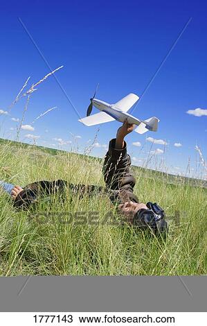 Stock Image - A child with a model airplane. Fotosearch