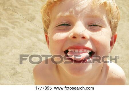 A close-up (closeup close up) of a child sticking out his tongue View Large Photo Image Stock Photography - A close-up (closeup close up) of a child sticking out his tongue. Fotosearch