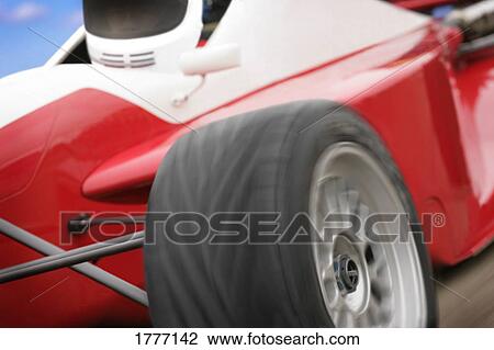 Stock Image - A close-up of a red race car. Fotosearch