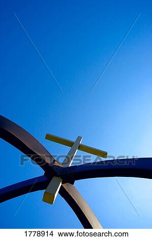 A cross suspended in arches View Large Photo Image Picture - A cross suspended in arches. Fotosearch