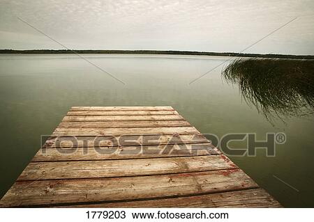 A dock at a lake View Large Photo Image Stock Image - A dock at a lake. Fotosearch