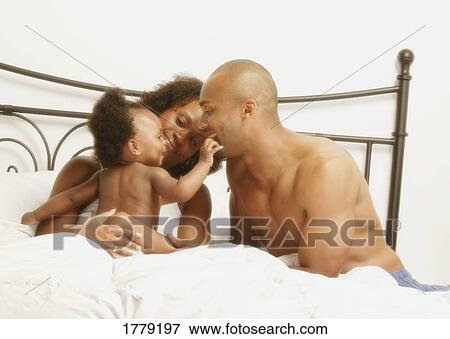 A family playing together View Large Photo Image Stock Photo - A family playing together. Fotosearch